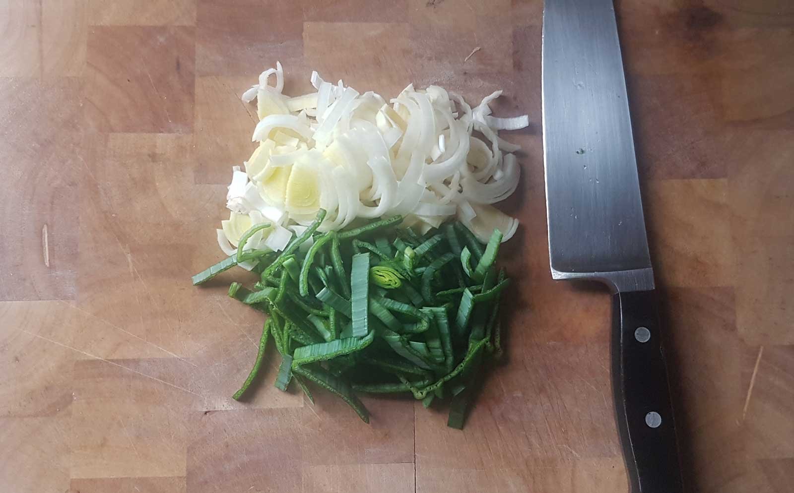 chopped leeks and a chef knife