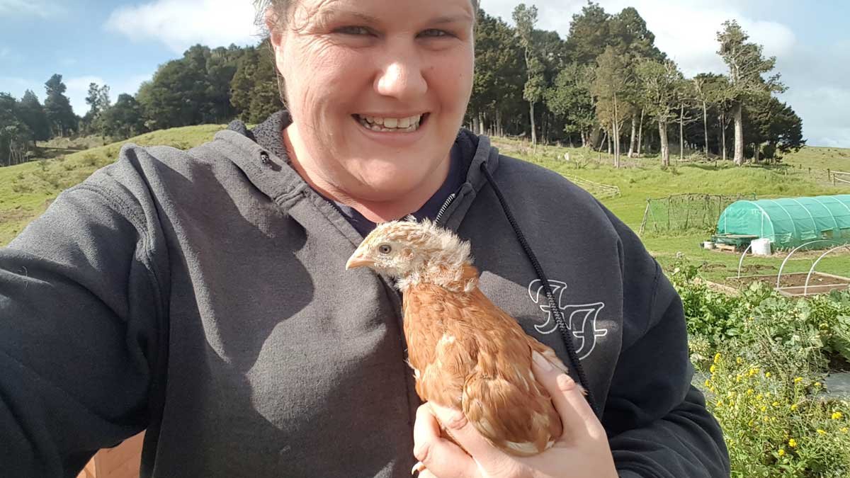 Kat and a new chicken at The Outpost