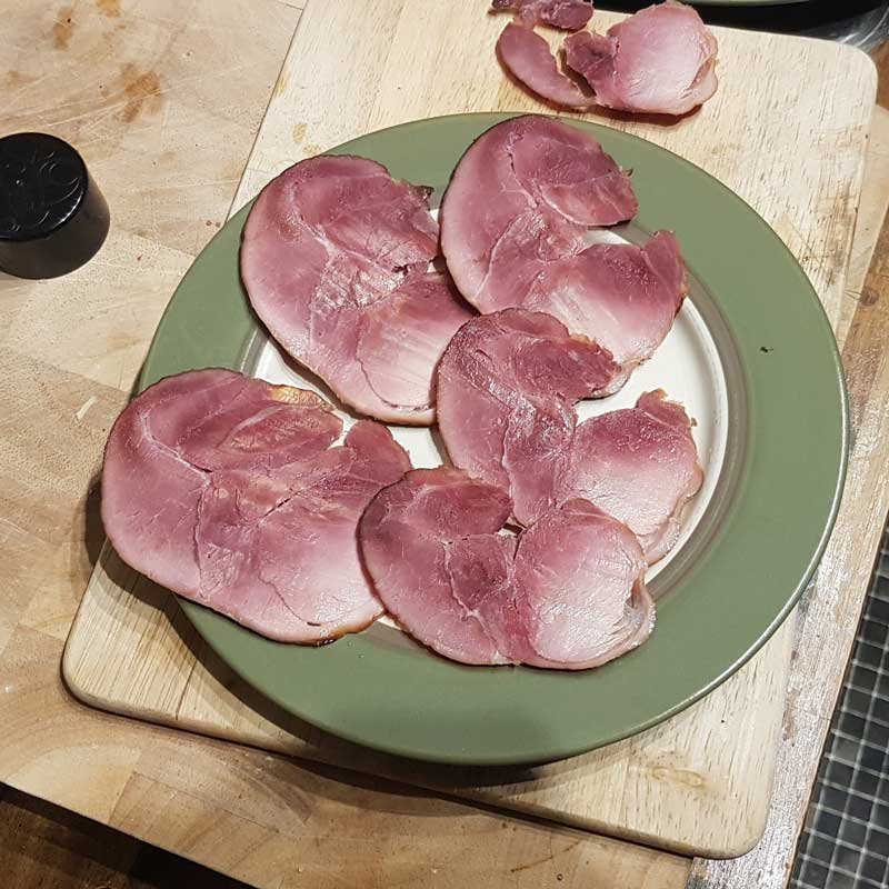 Bacon sliced onto a plate