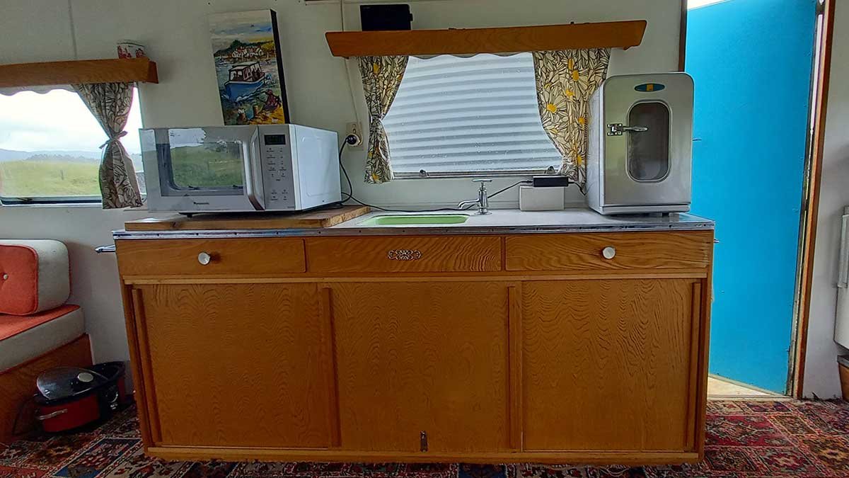 Kitchen bench with mini fridge and microwave