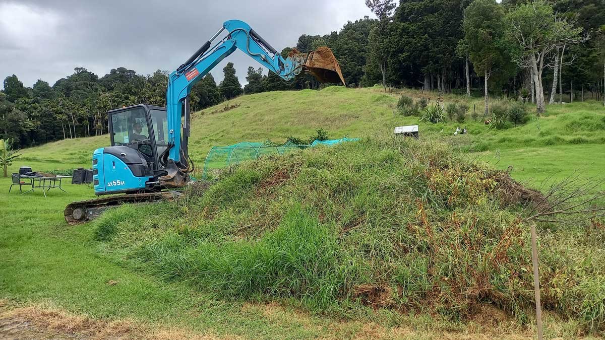 The digger, just before it began ripping into the pile of soil