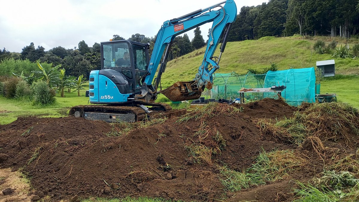 Richard making progressw on the soil mound with the digger.