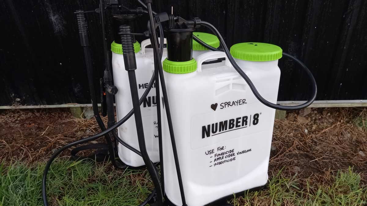 Two identical 15 litre backpack sprayers clearly marked for their intended purpose.