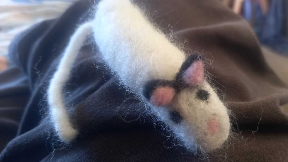 Version one of the catnip mouse, which looks like a tampon with ears and a face