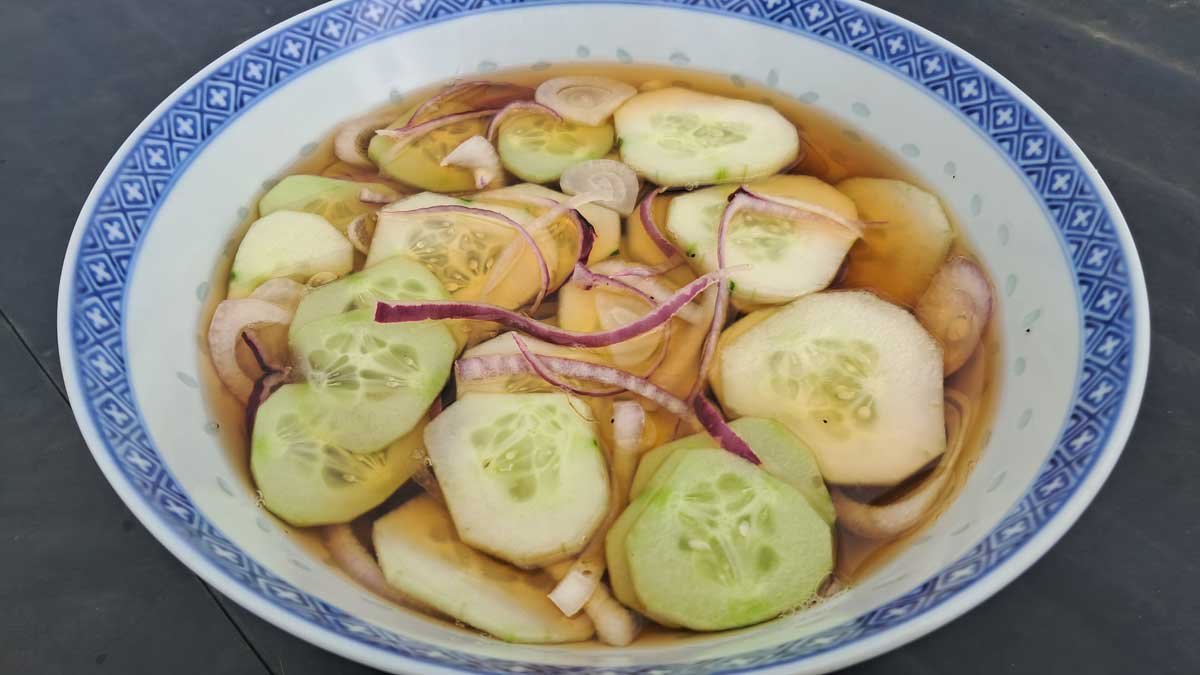 A bowl of cucumber and red onion quick pickle
