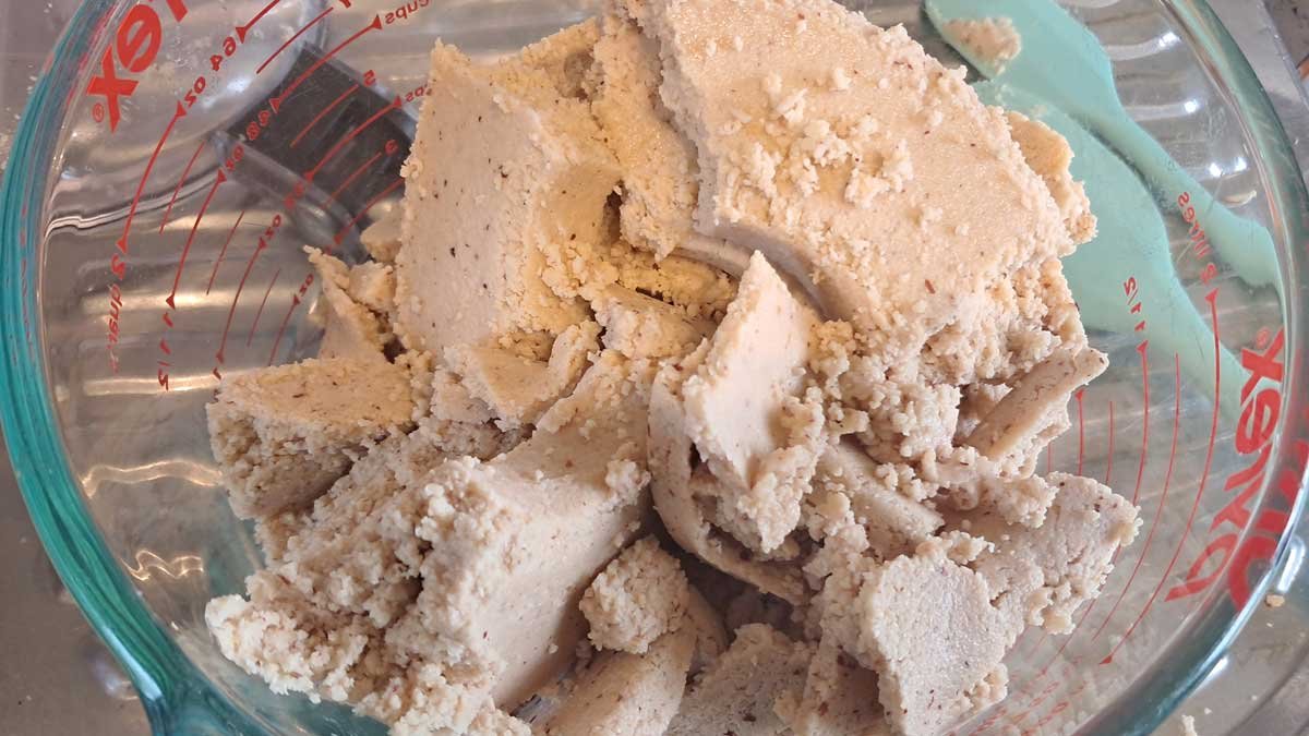 Compressed clumps of crushed peanuts.