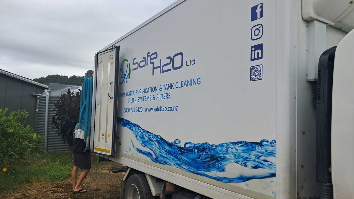 The Safe H2O truck backed up to our tank.