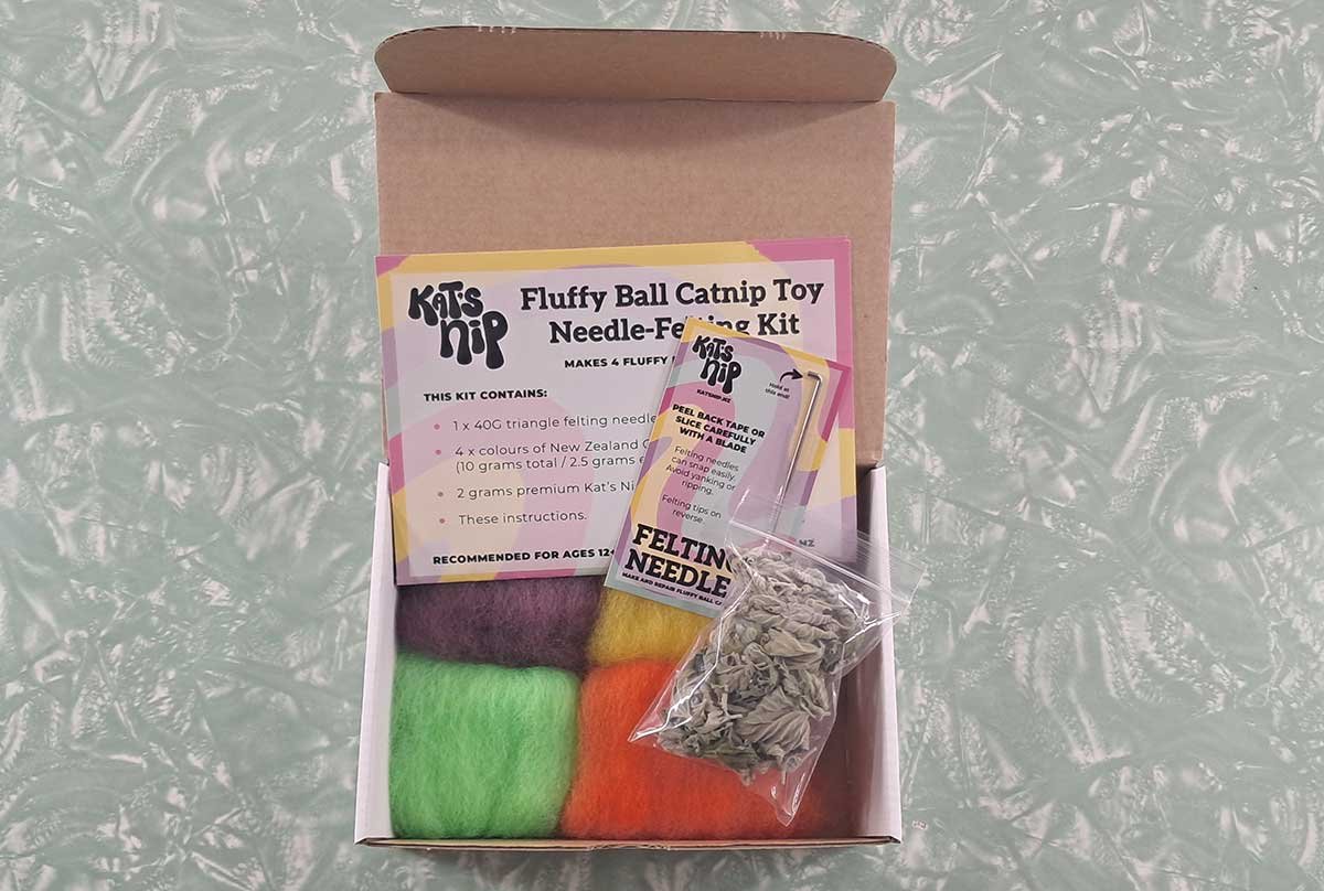 An open Kat's Nip Catnip Toy Needle Felting Kit showing the contents of the box.