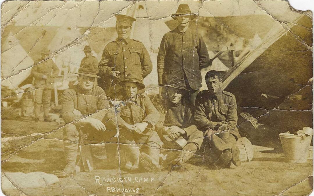 An old WW1 photo featuring 6 men and captioned 'Rangiotu Camp F.B. Hughes'.