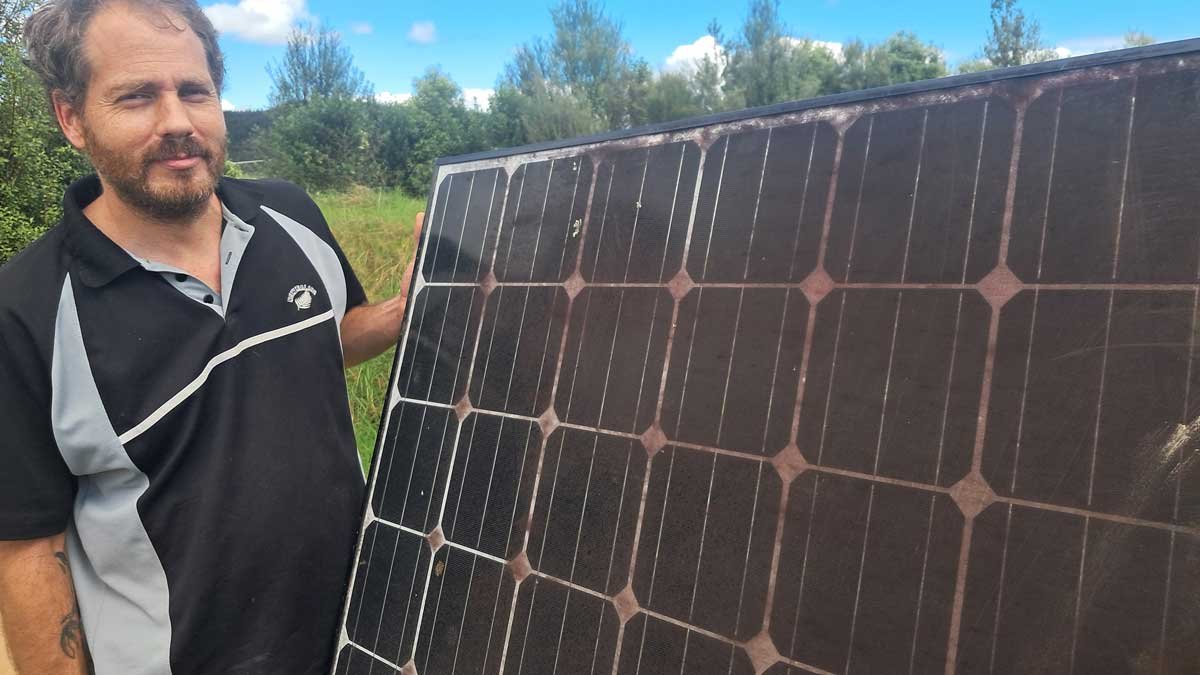 Richard with a very dirty solar panel.