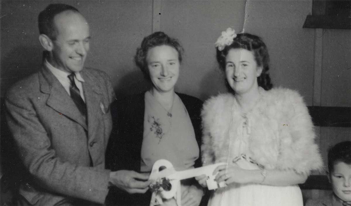 Shirley with her step father and mother at her 21st in 1948.
