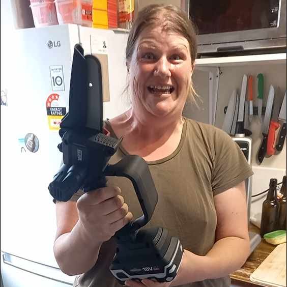 Kat in 2023 with her new mini chainsaw.