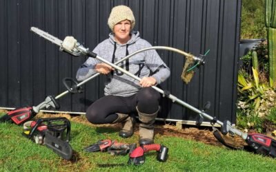 Kat posing with her collection of powertools like this is Tinder and they are fish.